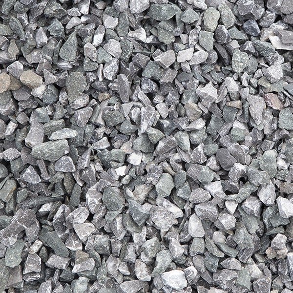 pea gravel is a popular choice for garden paths because it is small and easy to walk on